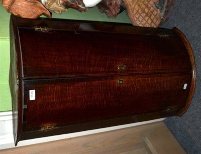 Lot 1186 - A Georgian bow fronted oak hanging corner cupboard