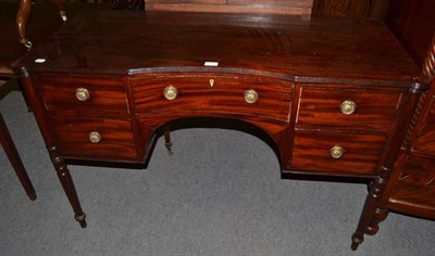 Lot 1210 - A late Regency mahogany and ebony strung dressing table, with reeded edge above an arrangement...