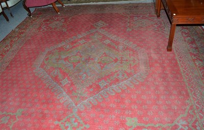 Lot 1211 - An Ushak Carpet, central Anatolia, the tomato red field centred by a diamond medallion framed...