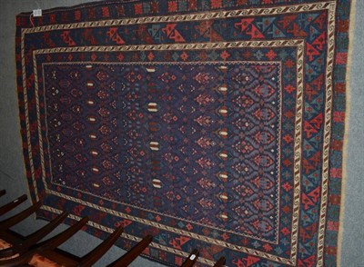 Lot 1214 - Shirvan rug, East Caucasus, circa 1920, the deep indigo lattice field of stylised plants...