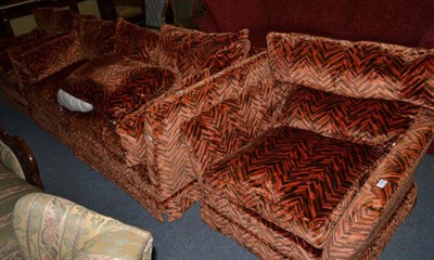 Lot 1238 - Three piece suite with repeating chevron pattern in black and orange