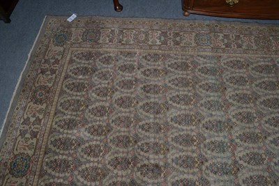 Lot 1248 - A Tabriz carpet, Iranian azerbaijan, the field with a one way boteh design enclosed by rosette...