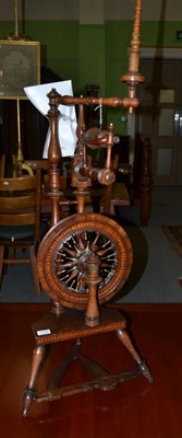 Lot 1255 - A good early spinning wheel, circa 1780-1820, the mahogany frame with inlaid overlapping disks...