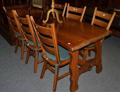 Lot 1265 - A reproduction oak refectory table and six ladder back chairs