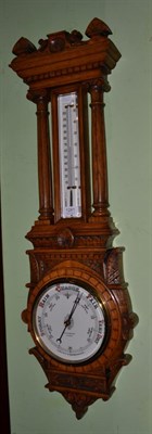 Lot 1281 - A Shoolbread & Co aneroid barometer, in carved oak case