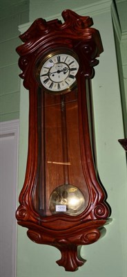 Lot 1310 - A carved mahogany Vienna style wall clock