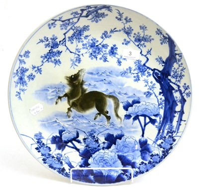Lot 3 - A Chinese blue and white charger, late 19th/early 20th century, depicting a horse in an...