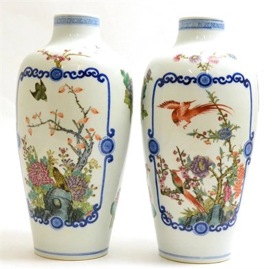 Lot 4 - A pair of Chinese vases decorated with flowers, 27.5cm high
