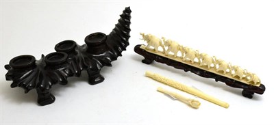 Lot 9 - Early 20th century carved ivory elephants with later stands and two cheroot holders