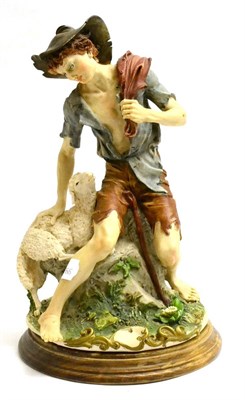 Lot 18 - A Capodimonte figure of a shepherd boy and a lamb, signed with monogram, 31cm high