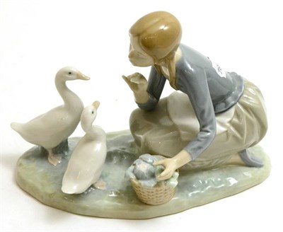 Lot 26 - A Lladro figure of a girl and geese, 18cm high