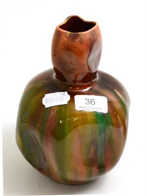 Lot 36 - A Burmantofts pottery red, yellow and green glazed vase, of dimpled bottle form, 20.5cm high
