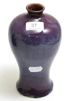 Lot 37 - A Chinese porcelain lilac flambe baluster vase, Qing Dynasty, 21cm high