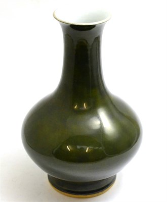 Lot 39 - A large Chinese porcelain green glazed bottle vase, Qing Dynasty, 35cm high, ex M J Coltman...