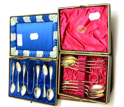 Lot 44 - A cased set of silver coffee spoons and a cased set of silver teaspoons