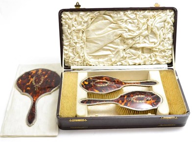 Lot 56 - A six piece cased silver mounted tortoise shell backed dressing table set