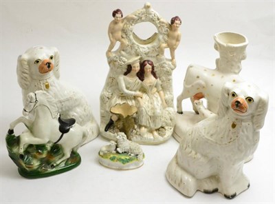 Lot 57 - A tray of Staffordshire flat back figures including a clock group, pair of seated spaniels etc