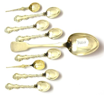 Lot 59 - A set of six silver teaspoons, Birmingham, an early Victorian silver serving spoon, London 1840 and