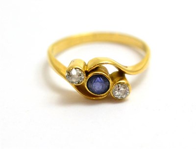 Lot 60 - A diamond and sapphire set ring stamped '18CT'