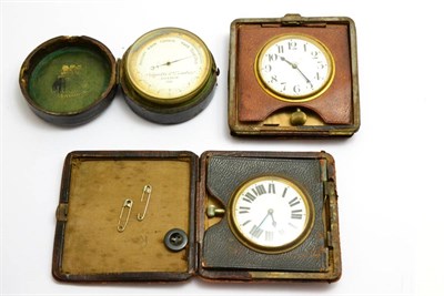 Lot 100 - A cased barometer signed Negretti Zambra, London and two travelling timepieces (3)
