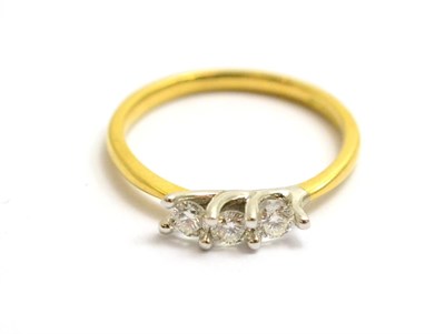 Lot 103 - An 18ct gold diamond three stone ring