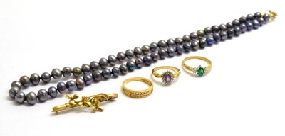 Lot 107 - A 9ct gold emerald and diamond three stone ring, a 9ct gold diamond two row ring, a cluster ring, a
