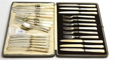 Lot 148 - A cased set of six fruit knives and forks, each with silver blades and mother of pearl handles, set