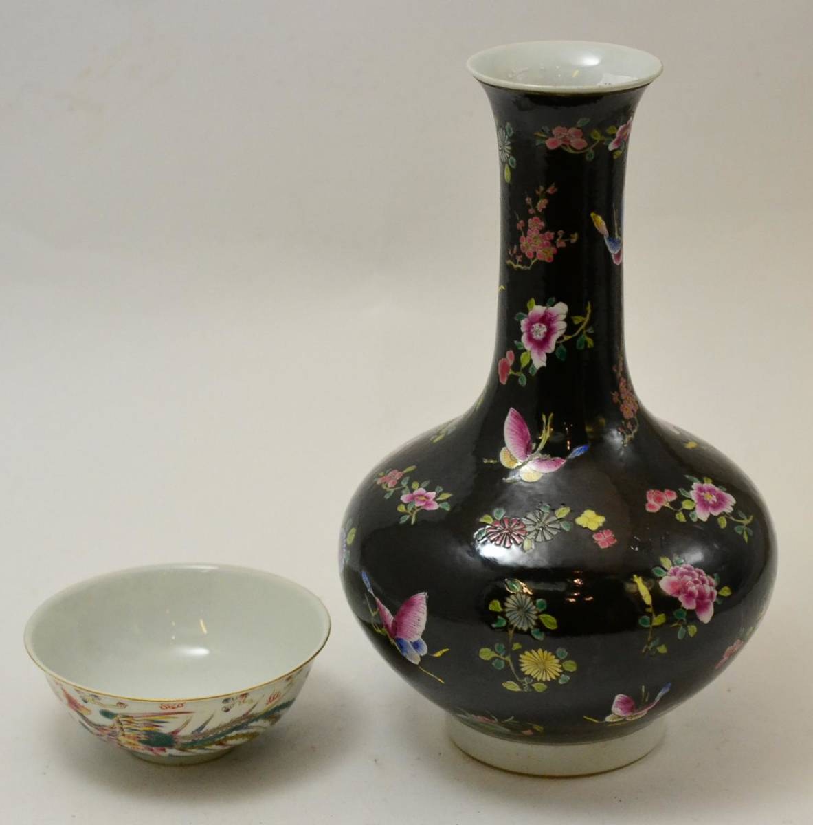 Lot 198 - A Chinese famille noir vase, 33cm high, together with a porcelain bowl, 14cm diameter