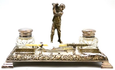 Lot 213 - An early 20th century silver plated golfing desk inkwell, comprising a figure of a golfer...