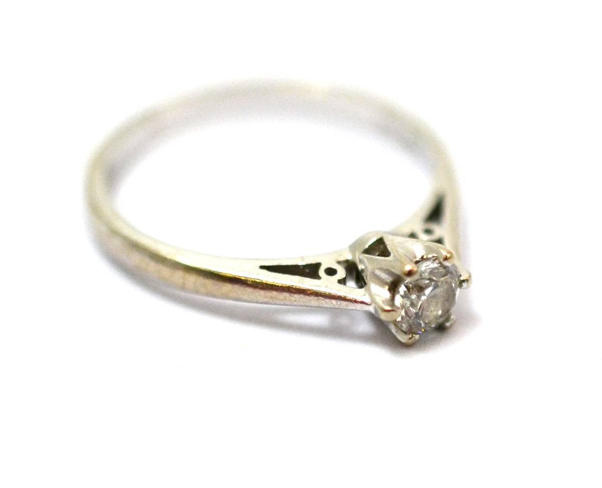 Lot 237 - An 18 carat white gold diamond solitaire ring, a round brilliant cut diamond in a six claw setting