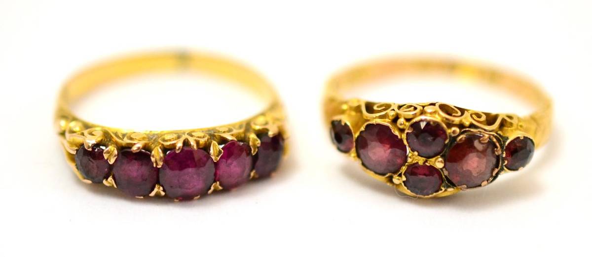 Lot 239 - A 15ct gold garnet cluster ring and a ruby five stone ring (2)