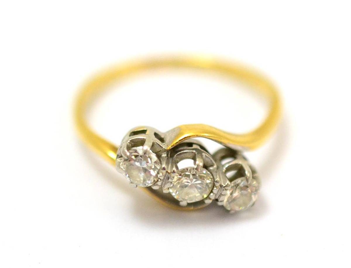 Lot 240 - A diamond three stone twist ring, estimated diamond weight 0.40 carat approximately