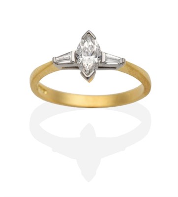 Lot 213 - An 18 Carat Gold Diamond Ring, a marquise cut diamond to tapered baguette cut diamond set...