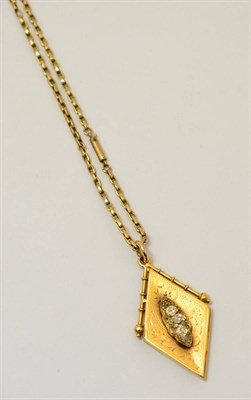 Lot 265 - A diamond set locket on a fancy link chain