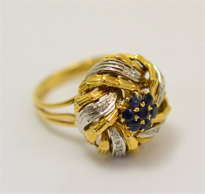 Lot 268 - A sapphire and diamond set floral cluster ring, a cluster of sapphires in yellow claw settings,...