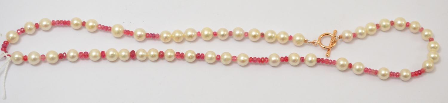 Lot 275 - A pink spinel and cultured pearl necklace, faceted pink spinel strung with cultured pearls,...