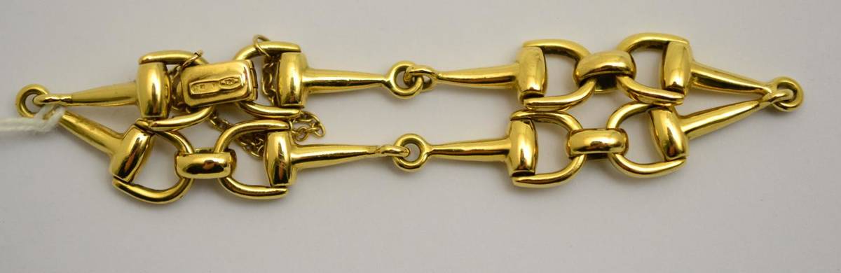 Lot 280 - An 18ct gold stirrup bracelet