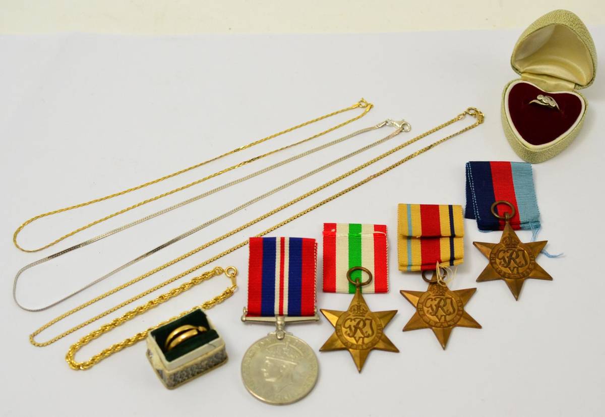 Lot 284 - Two gold wedding bands, diamond ring, necklaces and four Second World War medals