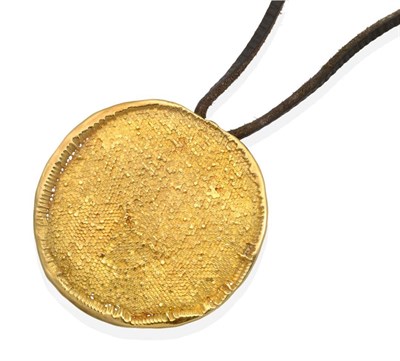 Lot 221 - An 18 Carat Gold Pendant, by Jaqueline Stieger,  a circular plaque with a textured surface, to...