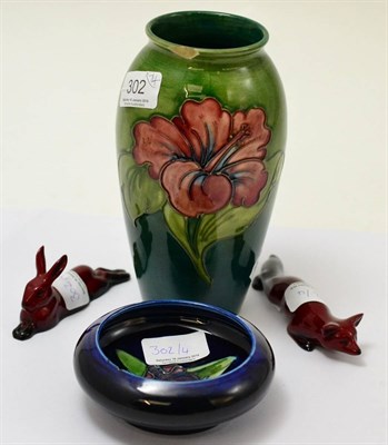 Lot 302 - A Walter Moorcroft hibiscus pattern vase, a Walter Moorcroft orchid pattern dish (both a.f.)...