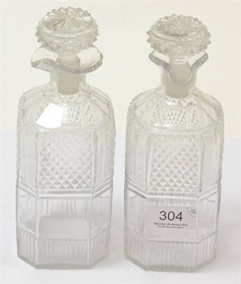 Lot 304 - A pair of 19th century cut glass decanters with spouts