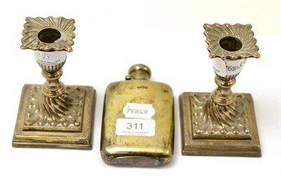 Lot 311 - A pair of silver loaded dwarf candlesticks and a silver flask