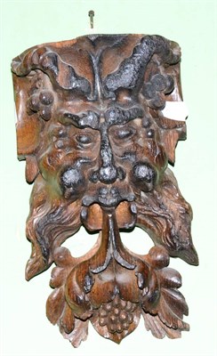 Lot 318 - A carved wooden green man mask, possibly 18th century