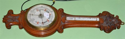 Lot 319 - An oak cased barometer