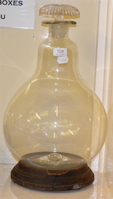 Lot 329 - A large glass carboy with stopper and stand