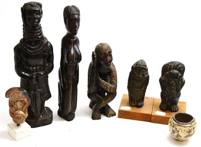 Lot 354 - A group of ethnographical carvings including three wooden African figures including a Benin...