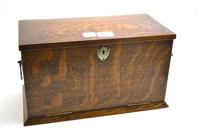 Lot 358 - An early 20th century oak correspondence box, the fall front with leather inset writing surface...