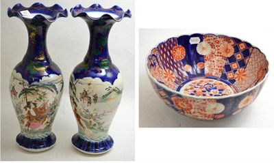 Lot 362 - A pair of Japanese porcelain vases, late 19th century, with wavy rims and painted in enamels...