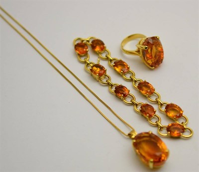 Lot 379 - A suite of citrine jewellery, including; a ring set with an oval mixed cut citrine in a yellow four