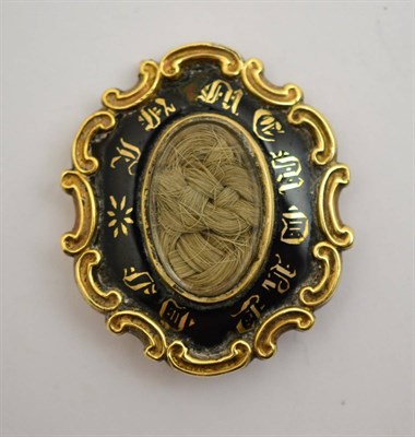 Lot 382 - A mourning brooch, inscribed to the reverse Jane * ob Jany 18 1857 at 27 (enamel a.f.),...